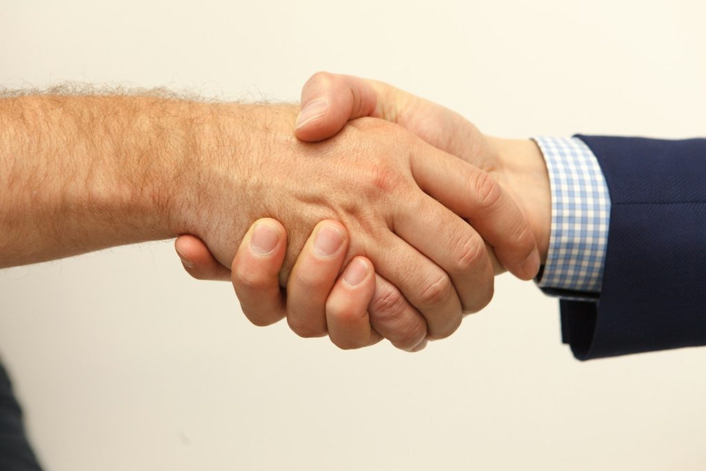 Handshake after a job offer, when the pay after placement fee becomes due