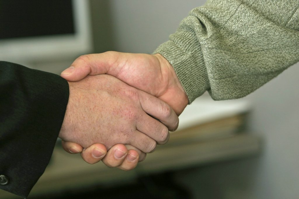 Handshake after a job offer, the point at which a pay after placement course in Pune is paid for